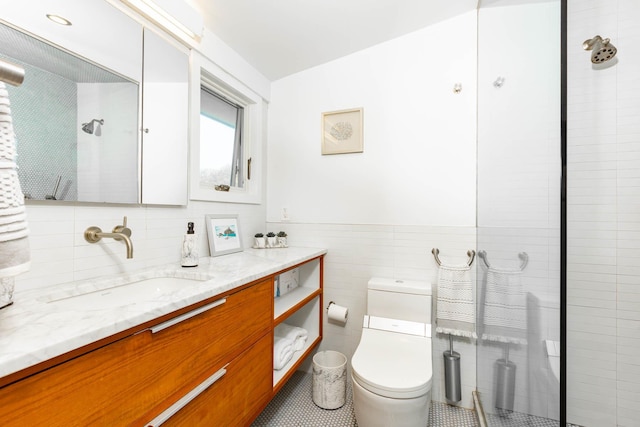 66 Hawser Dr, Oak Beach, NY 11702 - bathroom with tile walls, vanity, a shower, wainscoting, and tile patterned floors