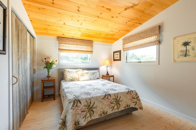 66 Hawser Dr, Oak Beach, NY 11702 - bedroom with wood-type flooring, vaulted ceiling, wooden ceiling, and a closet