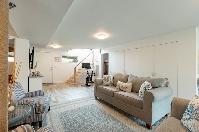 66 Hawser Dr, Oak Beach, NY 11702 - living room with stairs and light wood finished floors