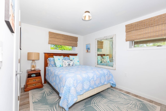 66 Hawser Dr, Oak Beach, NY 11702 - bedroom with wood finished floors and baseboards