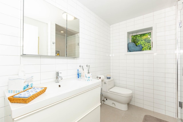 66 Hawser Dr, Oak Beach, NY 11702 - full bath with tile walls, tile patterned flooring, vanity, and a shower