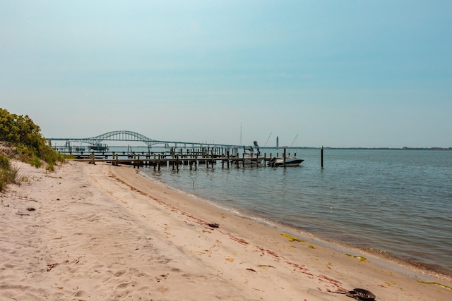 66 Hawser Dr, Oak Beach, NY 11702 - dock area featuring view of water and beach