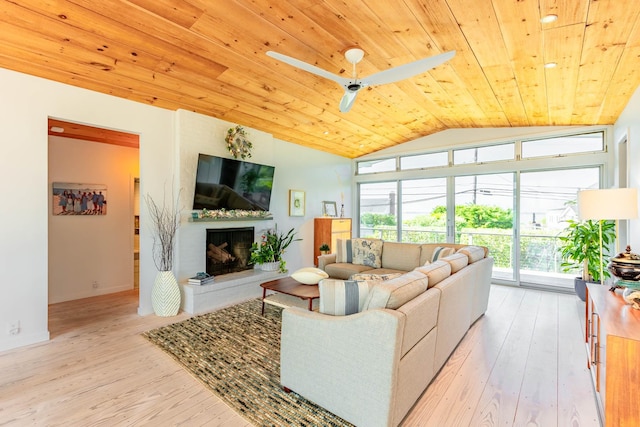 66 Hawser Dr, Oak Beach, NY 11702 - living room featuring wooden ceiling, lofted ceiling, a fireplace, light wood-type flooring, and ceiling fan