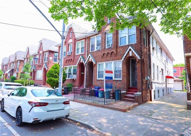 4215 Bedford Ave, Brooklyn, NY 11229 - multi unit property with brick siding, a residential view, entry steps, and cooling unit