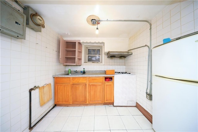 4215 Bedford Ave, Brooklyn, NY 11229 - kitchen with freestanding refrigerator, open shelves, tile walls, extractor fan, and light countertops