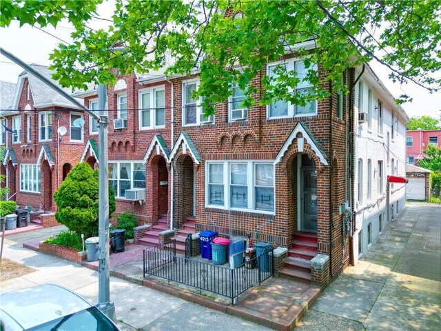 4215 Bedford Ave, Brooklyn, NY 11229 - view of front of property featuring brick siding, entry steps, and cooling unit