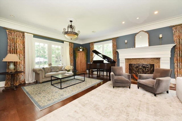 1616 Stewart Ln, Laurel Hollow, NY 11791 - living room featuring wood finished floors, ornamental molding, and a fireplace