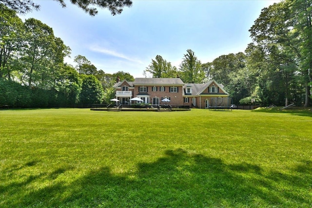1616 Stewart Ln, Laurel Hollow, NY 11791 - view of front of property with a front yard and a trampoline