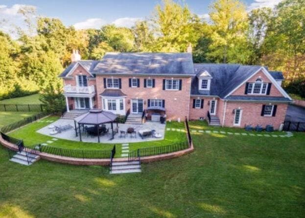 1616 Stewart Ln, Laurel Hollow, NY 11791 - rear view of house with entry steps, a fenced backyard, a patio, and a gazebo