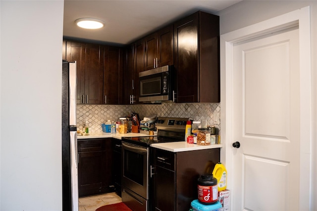 1602 Zerega Ave, Bronx, NY 10462 - kitchen featuring appliances with stainless steel finishes, light countertops, decorative backsplash, and dark brown cabinets