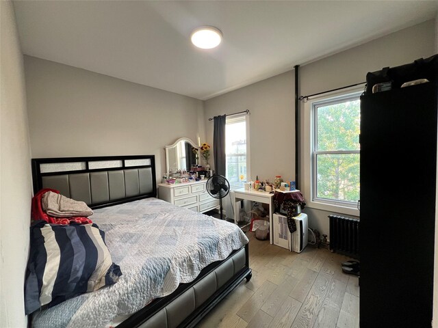 1602 Zerega Ave, Bronx, NY 10462 - bedroom featuring radiator and light wood finished floors