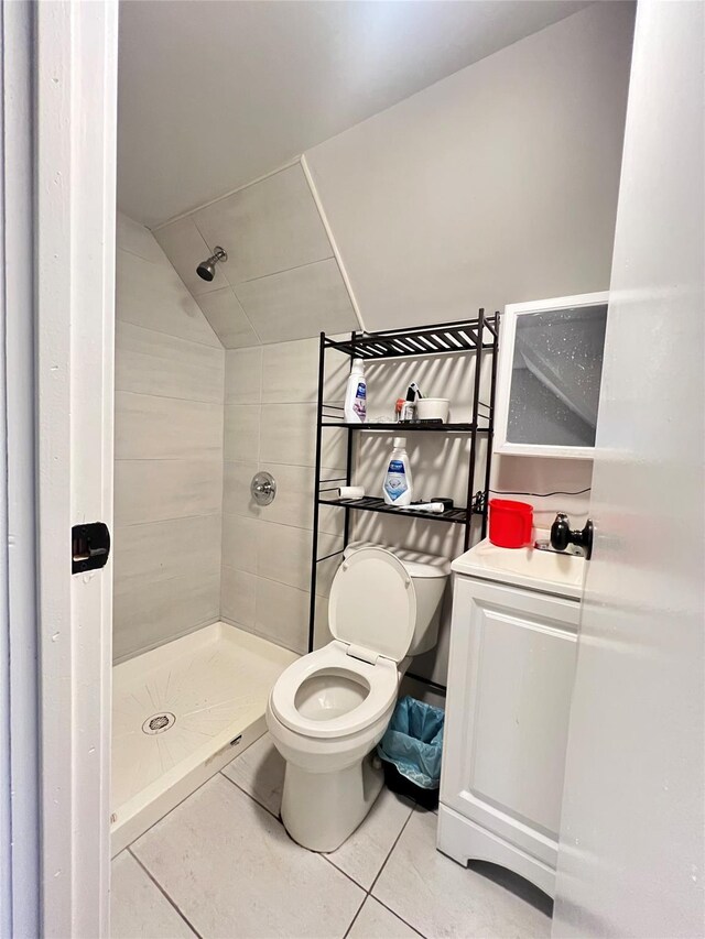 1602 Zerega Ave, Bronx, NY 10462 - bathroom with tile patterned floors, a shower stall, and vaulted ceiling
