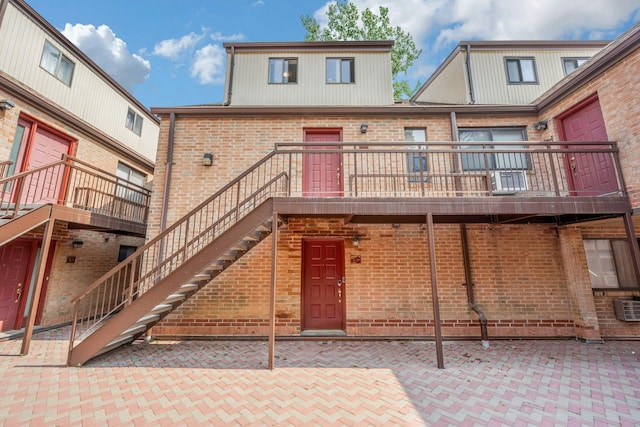 50 Dekalb Ave Unit S10, White Plains, NY 10605 - rear view of house featuring brick siding and a patio area