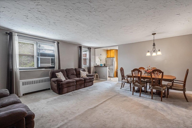 17-39 166th St Unit 3-68, Whitestone, NY 11357 - living area featuring radiator heating unit, light carpet, a chandelier, cooling unit, and a textured ceiling