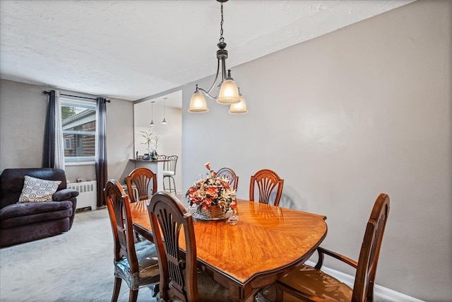 17-39 166th St Unit 3-68, Whitestone, NY 11357 - carpeted dining area with radiator and a textured ceiling