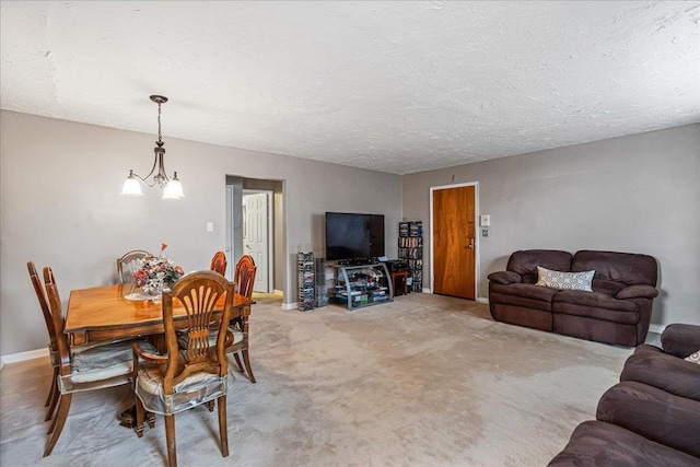 17-39 166th St Unit 3-68, Whitestone, NY 11357 - dining room featuring a chandelier, a textured ceiling, and light colored carpet