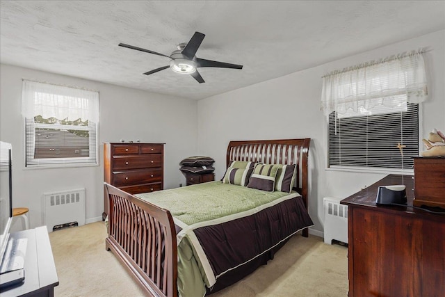 17-39 166th St Unit 3-68, Whitestone, NY 11357 - bedroom featuring radiator, light colored carpet, and ceiling fan