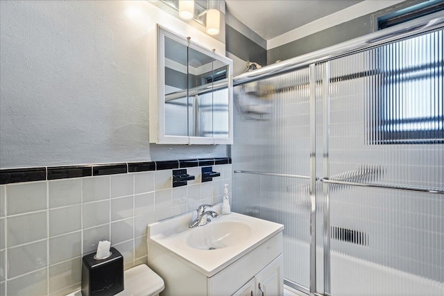 17-39 166th St Unit 3-68, Whitestone, NY 11357 - bathroom with vanity, a shower with shower door, a textured wall, and tile walls
