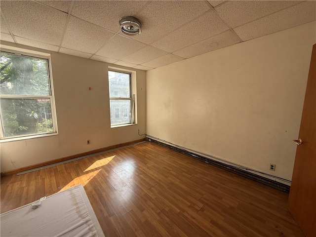 1363 64th St, Brooklyn, NY 11219 - spare room with a drop ceiling and wood finished floors