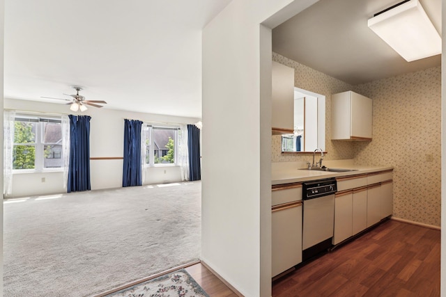 162 Deer Ct Dr, Middletown, NY 10940 - kitchen featuring white dishwasher, light countertops, dark wood-type flooring, open floor plan, and wallpapered walls