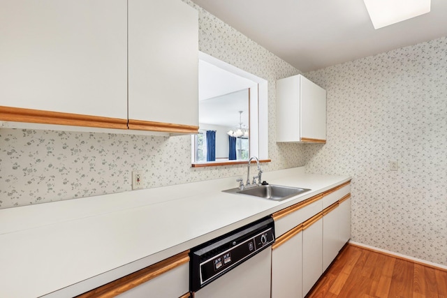 162 Deer Ct Dr, Middletown, NY 10940 - kitchen featuring white dishwasher, wallpapered walls, light wood finished floors, light countertops, and white cabinets