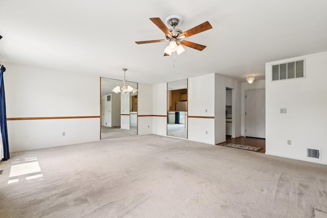 162 Deer Ct Dr, Middletown, NY 10940 - unfurnished living room featuring a chandelier, carpet flooring, and a ceiling fan