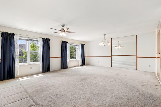 162 Deer Ct Dr, Middletown, NY 10940 - carpeted empty room featuring a chandelier and ceiling fan