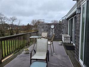 56 Pameeches Path, East Moriches, NY 11940 - view of patio with outdoor dining space and a deck