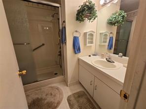 56 Pameeches Path, East Moriches, NY 11940 - full bathroom featuring vanity and a shower stall