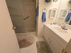 56 Pameeches Path, East Moriches, NY 11940 - full bath featuring a shower stall, vanity, and tile patterned flooring