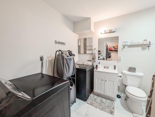 15 Fairview Cir, Middle Island, NY 11953 - bathroom with washer / dryer, vanity, and marble look tiles