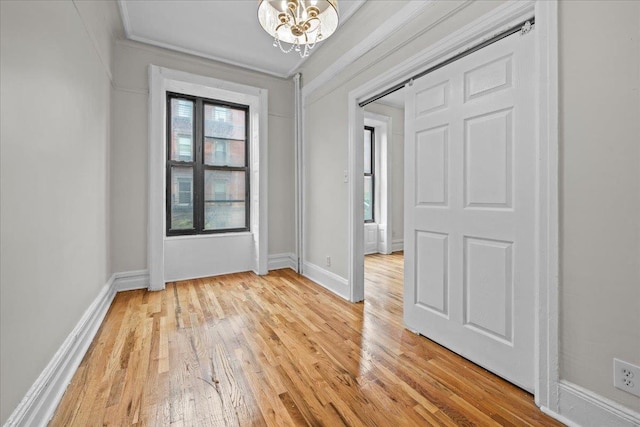 176 W 81st St Unit 3E, New York Manhattan, NY 10024 - entryway with light wood finished floors and a chandelier