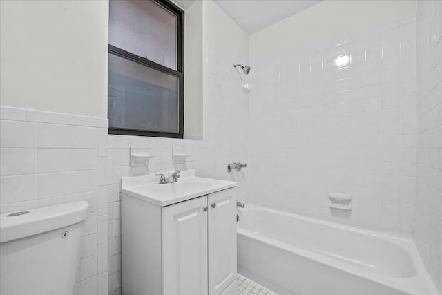 176 W 81st St Unit 3E, New York Manhattan, NY 10024 - bathroom featuring vanity, washtub / shower combination, tile walls, and wainscoting