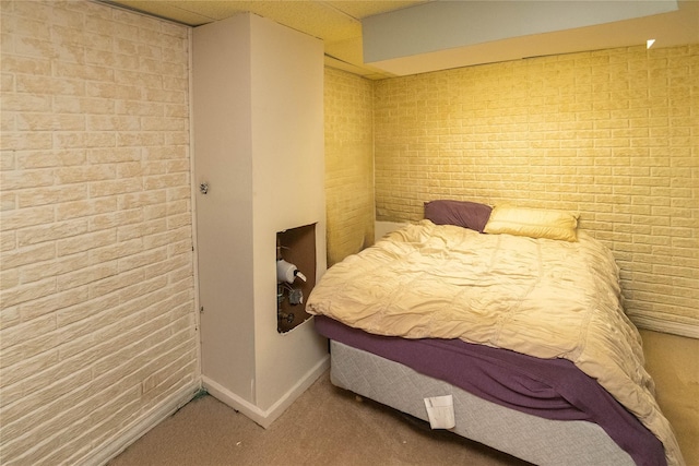 134 Elmcrest Dr, Fishkill, NY 12524 - carpeted bedroom featuring brick wall and baseboards