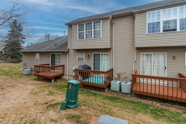 134 Elmcrest Dr, Fishkill, NY 12524 - rear view of house with a deck and a lawn