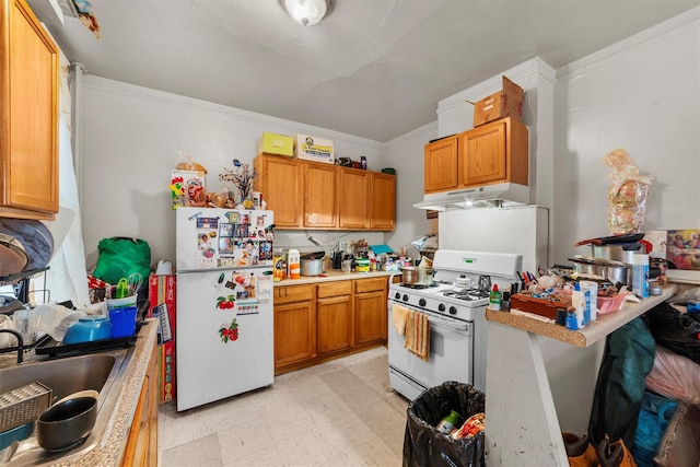 156 Beech St, Yonkers, NY 10701 - kitchen with white appliances, light flooring, under cabinet range hood, crown molding, and light countertops