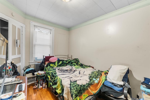 156 Beech St, Yonkers, NY 10701 - bedroom with radiator, crown molding, and wood-type flooring