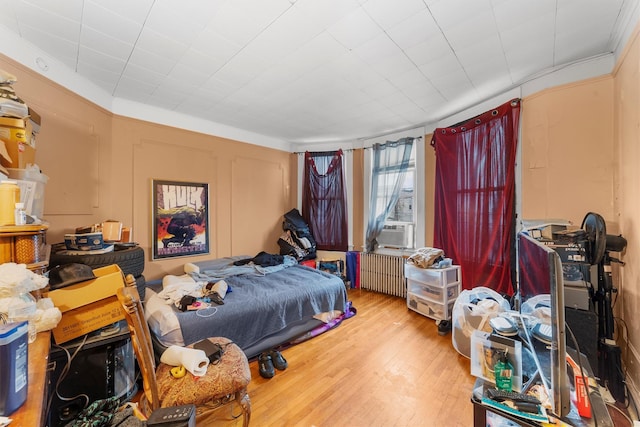 156 Beech St, Yonkers, NY 10701 - bedroom with wood finished floors, crown molding, radiator heating unit, and cooling unit
