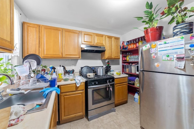 156 Beech St, Yonkers, NY 10701 - kitchen featuring stainless steel appliances, under cabinet range hood, light countertops, and light tile patterned flooring