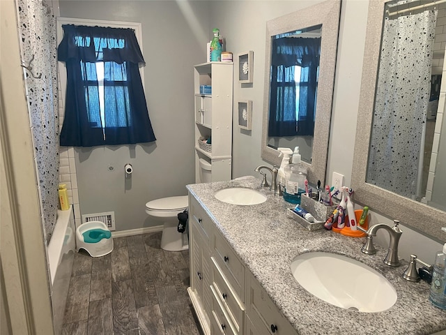 16 Drake Rd, Centereach, NY 11720 - bathroom with double vanity, wood finished floors, and shower / bath combination with curtain