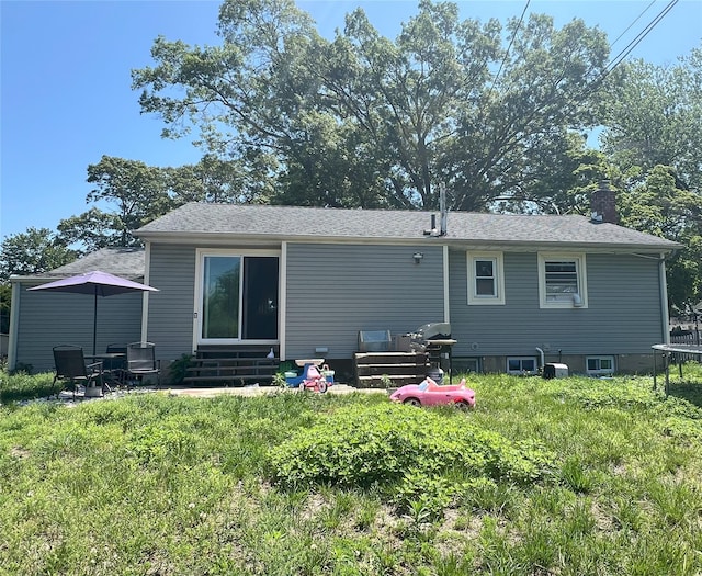 16 Drake Rd, Centereach, NY 11720 - back of house with entry steps and a chimney