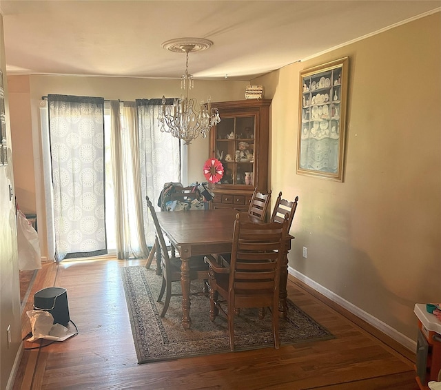 16 Drake Rd, Centereach, NY 11720 - dining area featuring a chandelier and wood finished floors