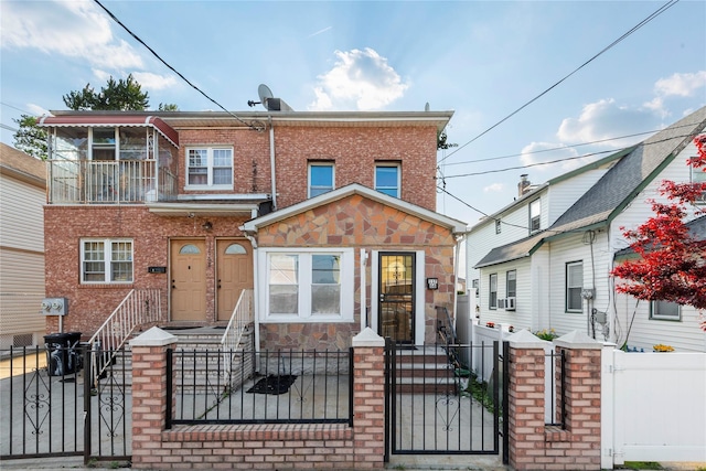 117-66 127th St, South Ozone Park, NY 11420 - multi unit property with a gate, a fenced front yard, brick siding, and stone siding