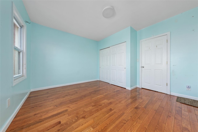 117-66 127th St, South Ozone Park, NY 11420 - unfurnished bedroom featuring hardwood / wood-style flooring and a closet