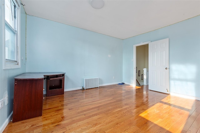 117-66 127th St, South Ozone Park, NY 11420 - empty room featuring radiator and wood finished floors