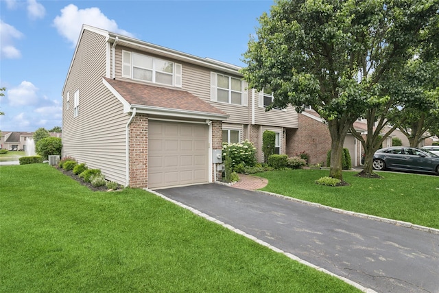 278 Pond View Ln, Smithtown, NY 11787 - view of front of home with brick siding, an attached garage, asphalt driveway, and a front yard