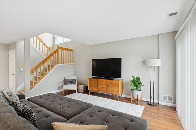 278 Pond View Ln, Smithtown, NY 11787 - living area with stairway and wood finished floors