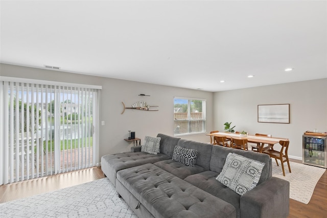 278 Pond View Ln, Smithtown, NY 11787 - living area featuring beverage cooler, wood finished floors, and recessed lighting