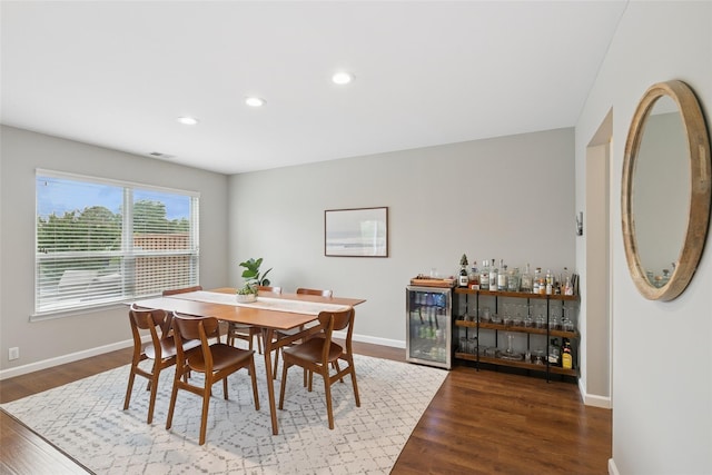 278 Pond View Ln, Smithtown, NY 11787 - dining area featuring wine cooler, wood finished floors, recessed lighting, and a dry bar
