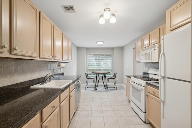 278 Pond View Ln, Smithtown, NY 11787 - kitchen with white appliances, light brown cabinetry, decorative backsplash, light tile patterned flooring, and dark countertops